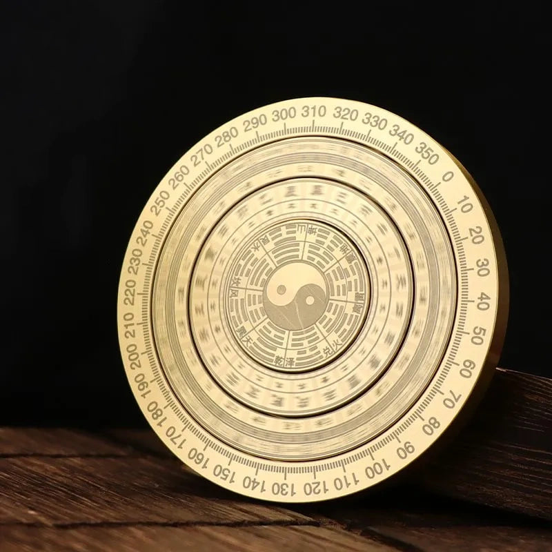 Solid brass compass fingertip spinner with a small compass and an eight-trigram plate