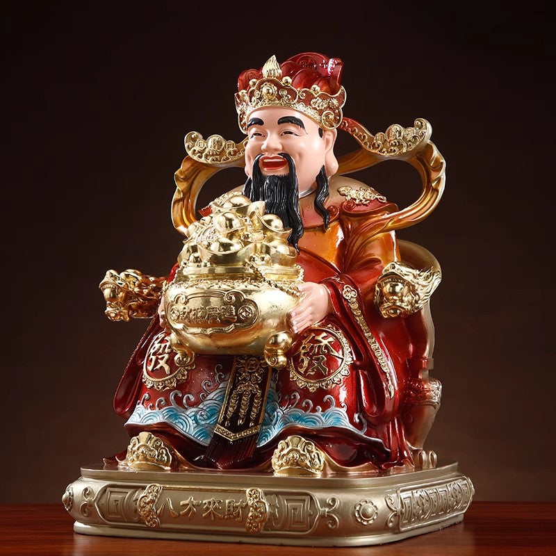 A household Buddhist statue of the God of Wealth for worship to attract wealth