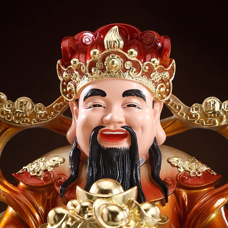 A household Buddhist statue of the God of Wealth for worship to attract wealth