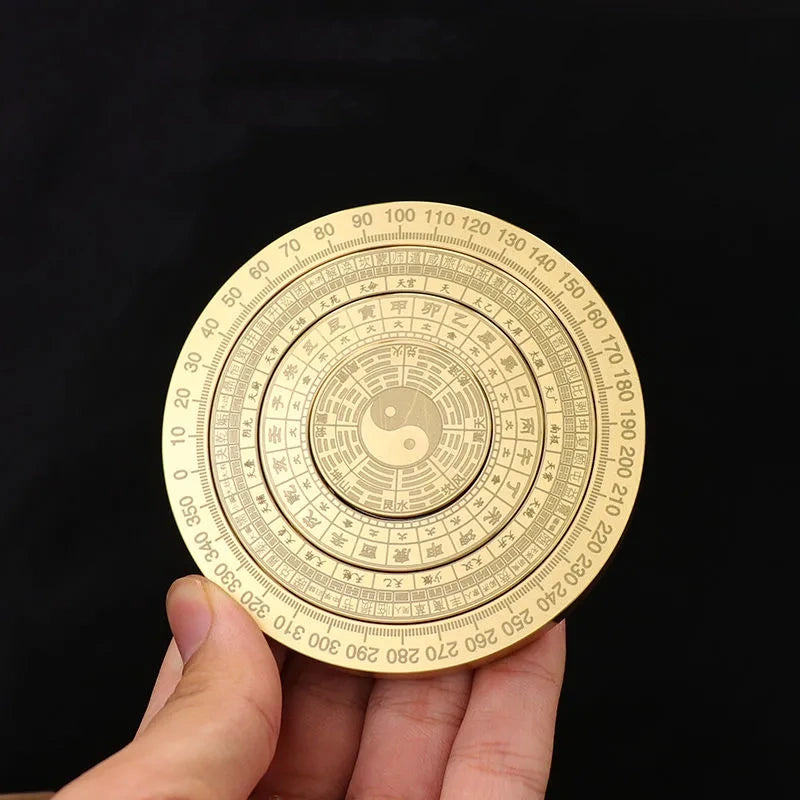 Solid brass compass fingertip spinner with a small compass and an eight-trigram plate